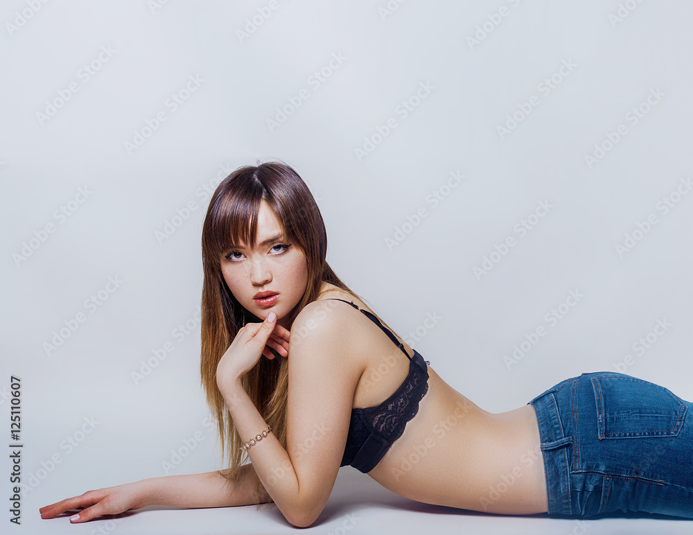 Pretty girl portrait lying and looking at camera Pretty girl portrait lying and looking at camera