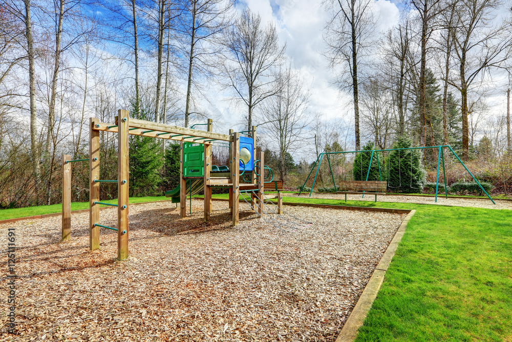 Children playground at a backyard of residential area. Children playground at a backyard of residential area.