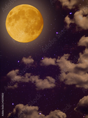 Full yellow moon with star at dark clouds night sky background
