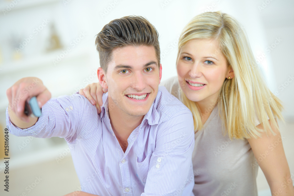 couple with remote couple with remote