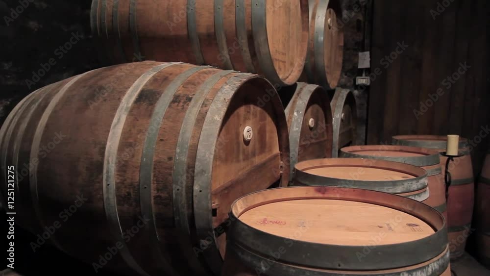 Large wine barrels in the cellar at the winery Large wine barrels in the cellar at the winery
