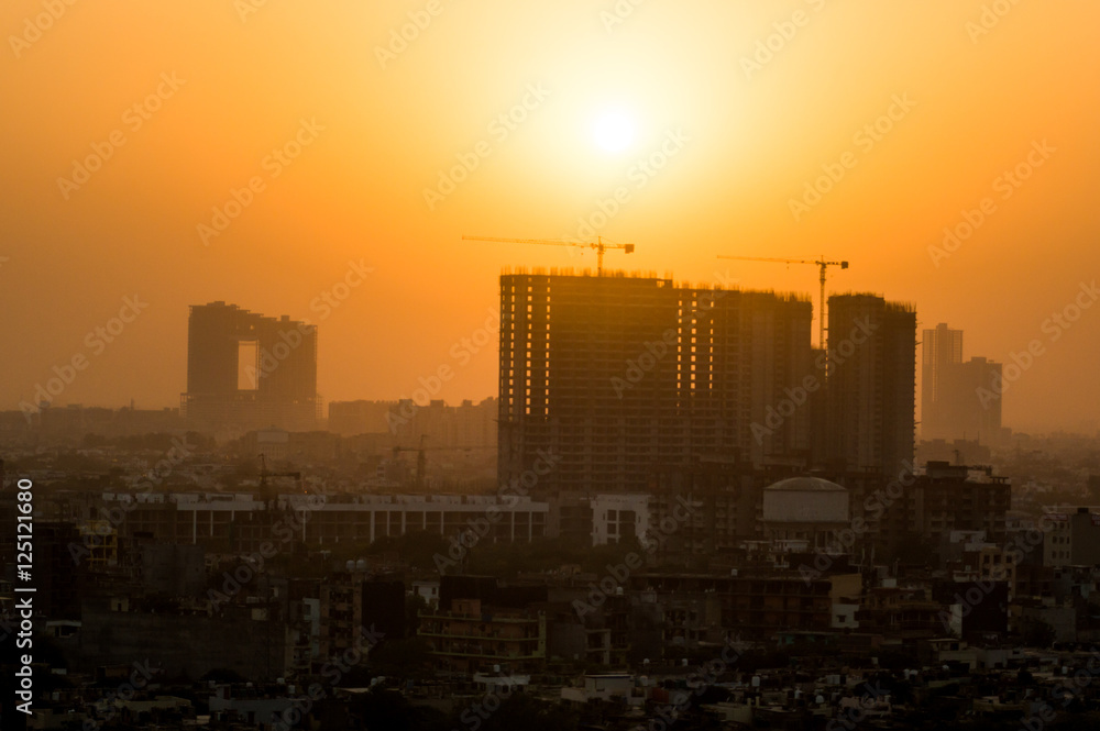 Buildings under construction at dusk 