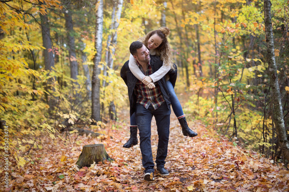 Nice couple having fun in autumn park Nice couple having fun in autumn park