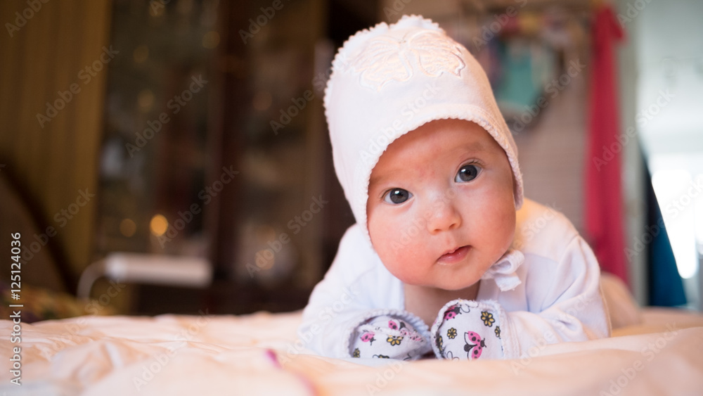 The newborn baby learns to hold his head Stock Photo Adobe Stock