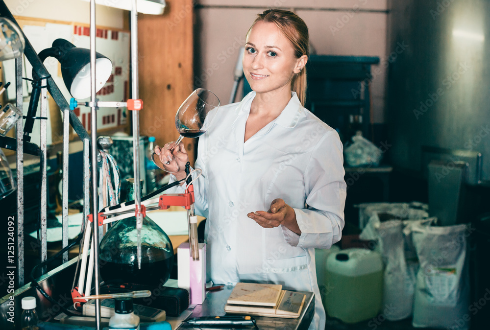 Winery technician in laboratory StockFoto Adobe Stock