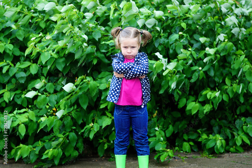 Adorable sad toddler girl at rainy day in autumn Adorable sad toddler girl at rainy day in autumn