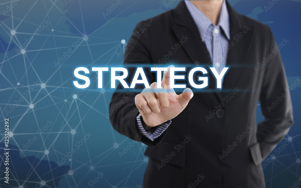 Businessman hand pressing button strategy. sign on virtual screen.business concept. Businessman hand pressing button strategy. sign on virtual screen.business concept.
