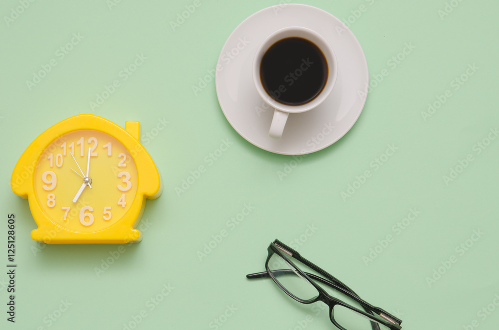 Clock , coffee and glasses in flat lay style Clock , coffee and glasses in flat lay style