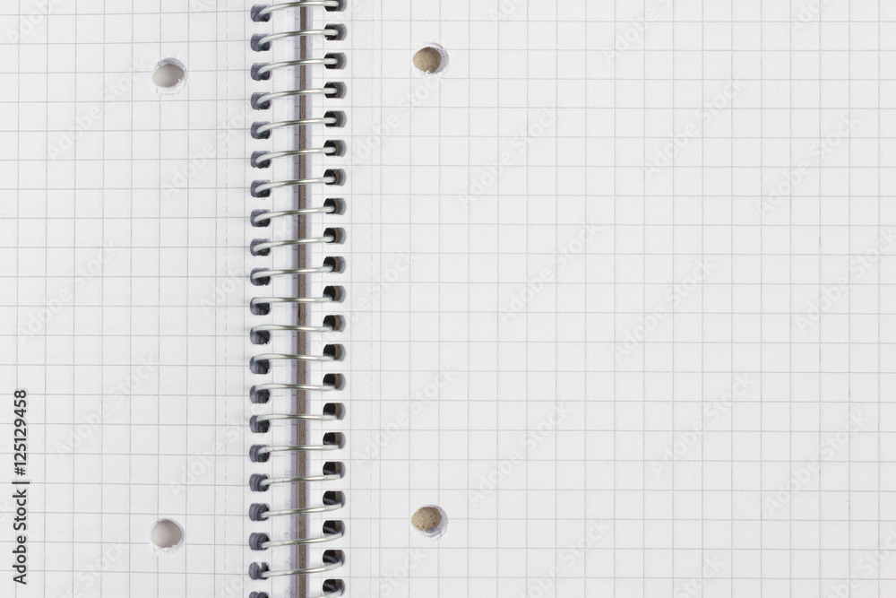 Close up of a notebook with metallic spiral Close up of a notebook with metallic spiral