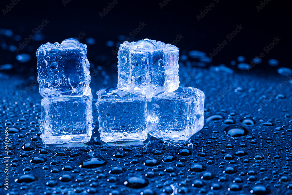 Wet ice cubes and water drop on blue background. Wet ice cubes and water drop on blue background.