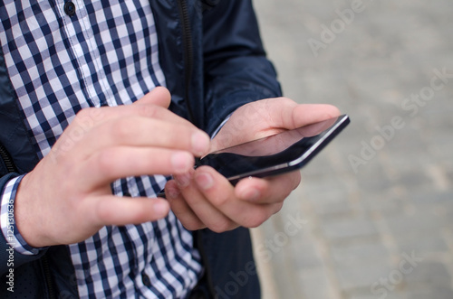 Young man using his phone