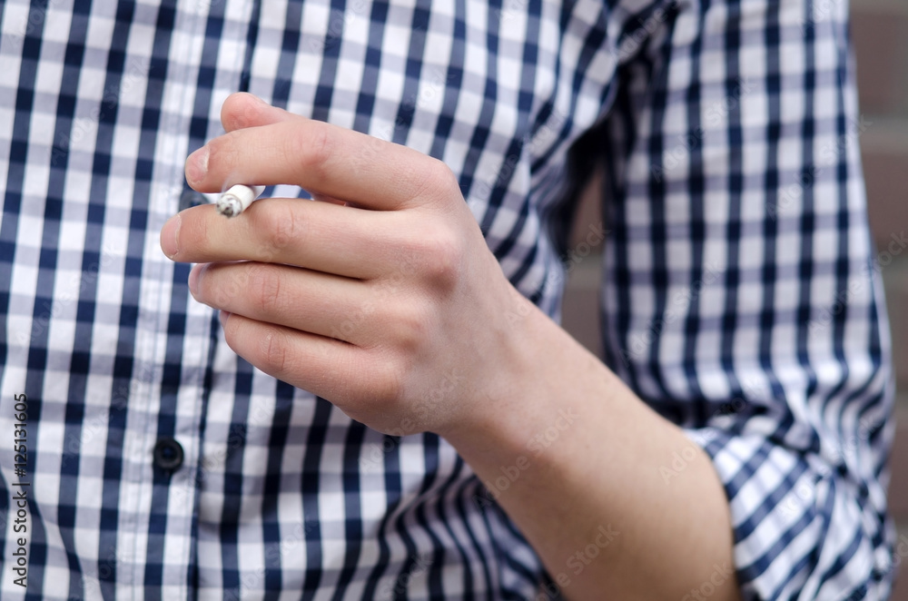 Young man smoking cigarette Young man smoking cigarette