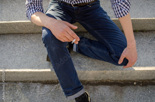 Young man smoking cigarette 