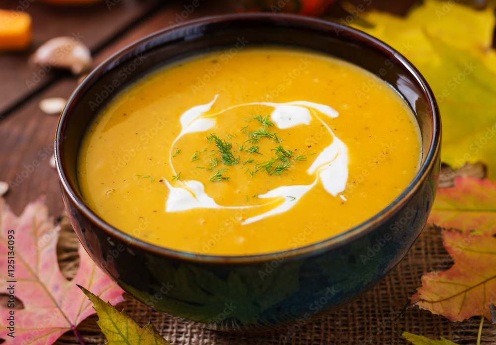 Cream of pumpkin soup with sour cream sauce. Halloween. Cream of pumpkin soup with sour cream sauce. Halloween.