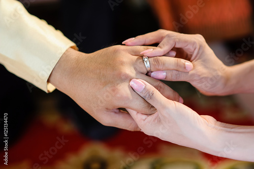 wedding rings together in hands