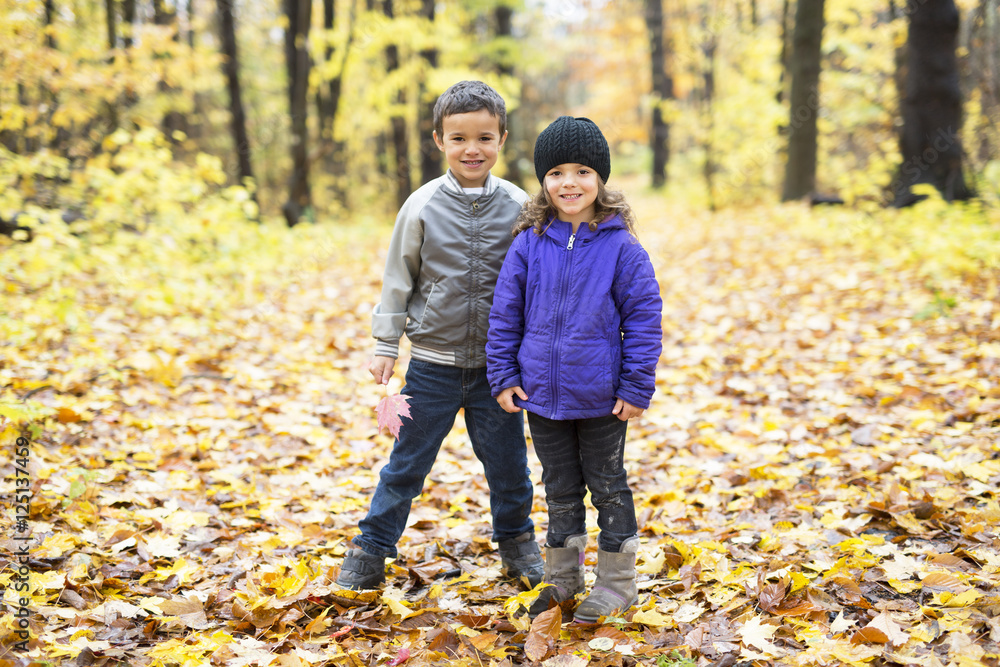 Happy children playing in beautiful autumn park Happy children playing in beautiful autumn park