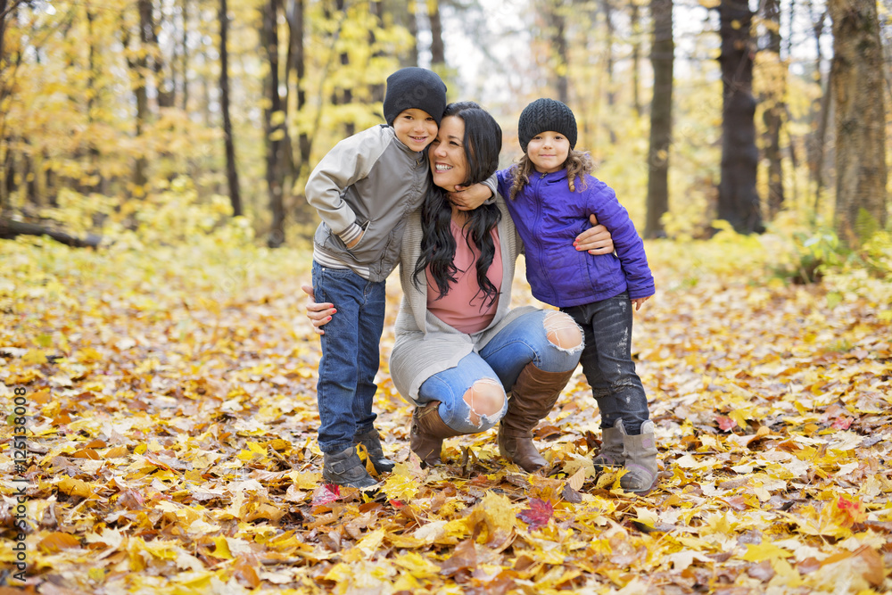 Happy family having fun on beautiful autumn day