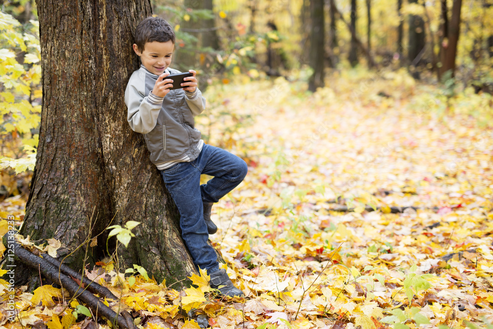 Six years old child autumn season in a park Six years old child autumn season in a park