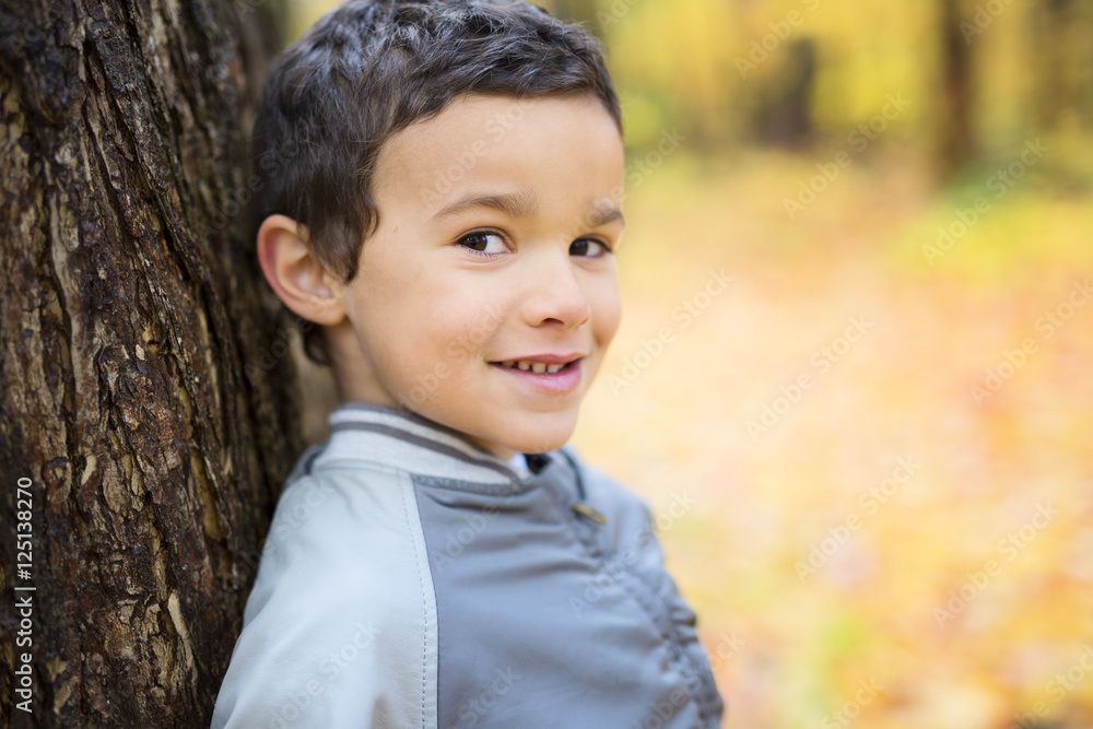 Six years old child autumn season in a park Six years old child autumn season in a park