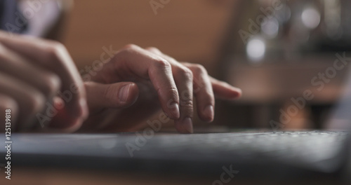 young man working on notebook in cafe or home hands closeup © GCapture