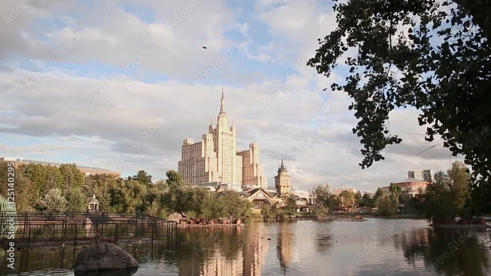 MOSCOW, RUSSIA - JUNE 1, 2016: Kudrinskaya Square Building is one of seven Stalinist skyscrapers. Against the backdrop of the lake. MOSCOW, RUSSIA - JUNE 1, 2016: Kudrinskaya Square Building is one of seven Stalinist skyscrapers. Against the backdrop of the lake.