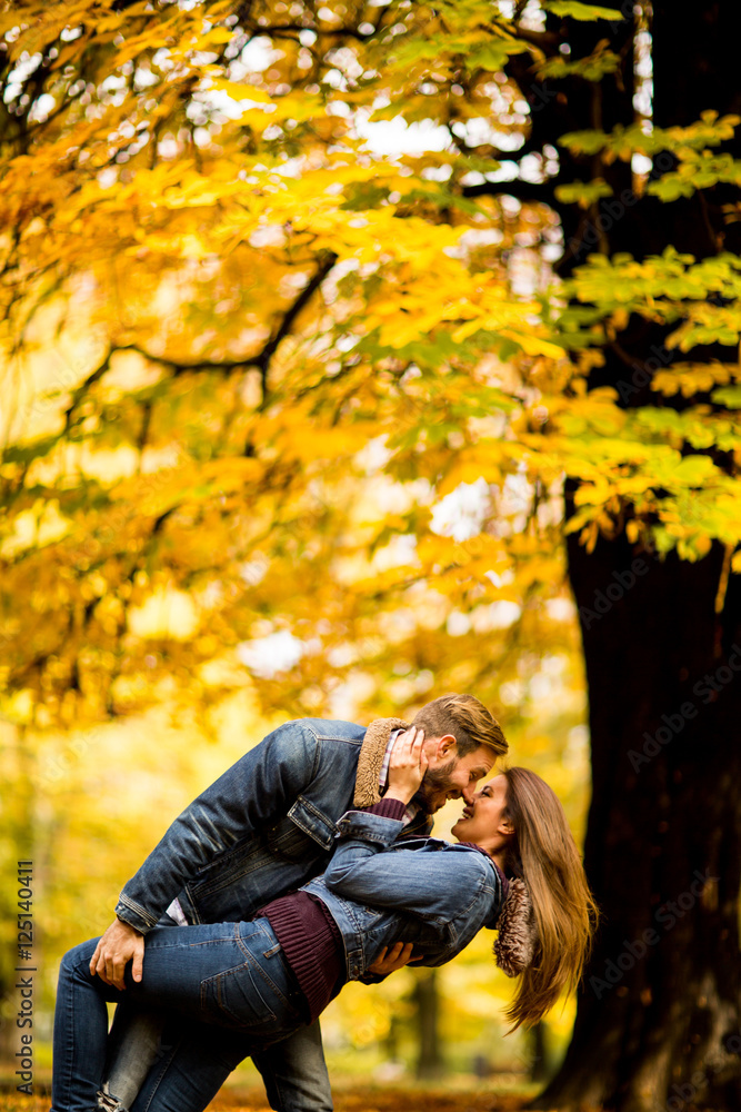 Young couple in the autumn park Young couple in the autumn park