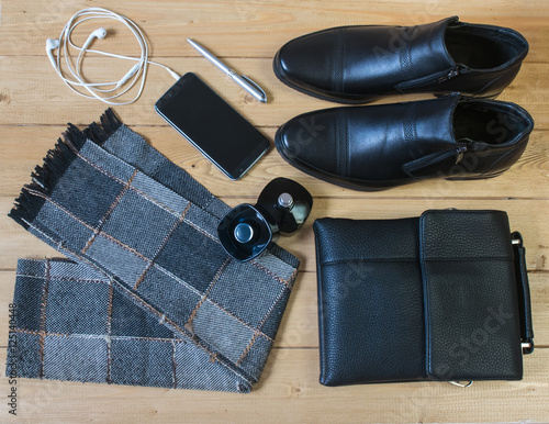 Business accessories for men on the wooden floor.