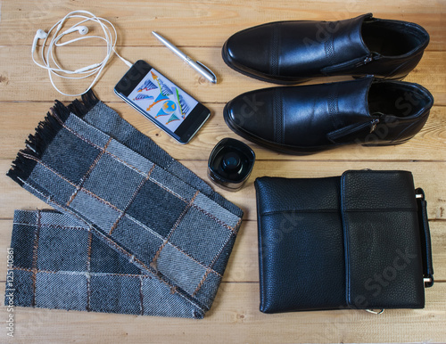 Business accessories for men on the wooden floor.