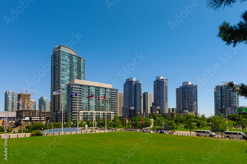 Toronto panoramic view from olympic park and metro convention center towards the skyscraper scenery - Beautiful and neat green park in Toronto, Canada