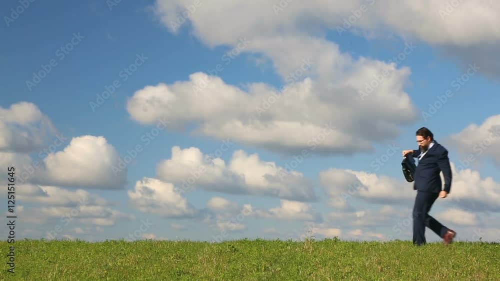 businessman dancing on beautiful sky background businessman dancing on beautiful sky background