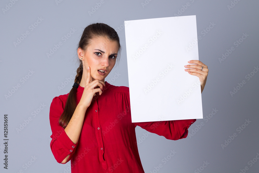 Woman holding white sheet of paper Woman holding white sheet of paper