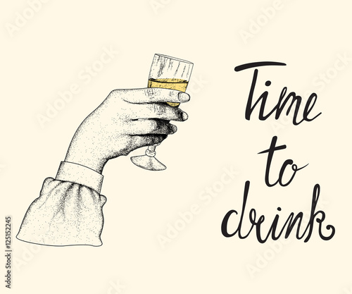 Female hand raises a glass of champagne