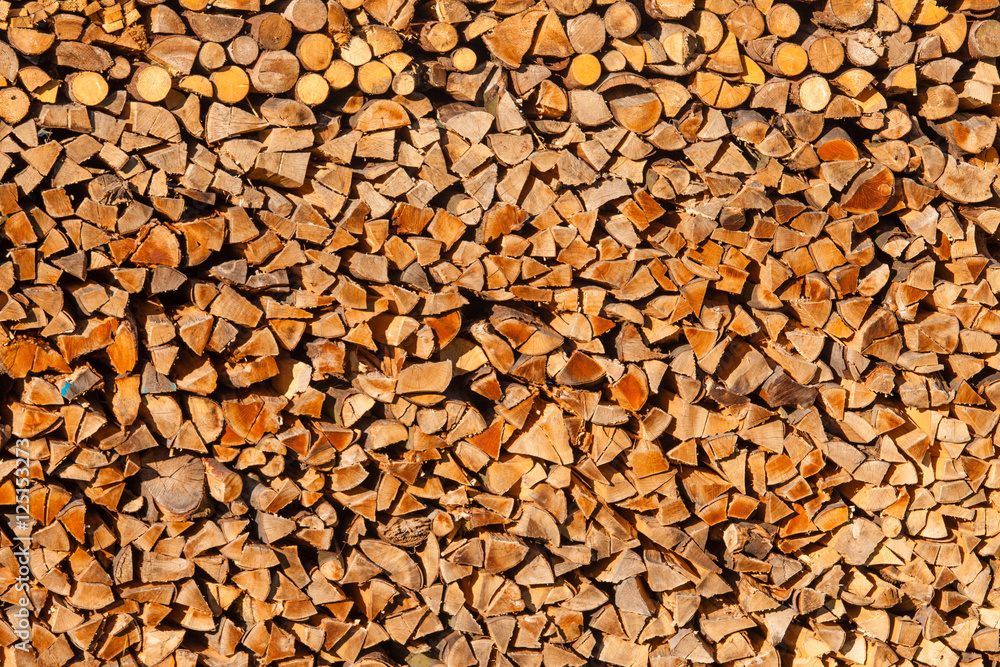 Piled split forest wood logs renewable heat energy Piled split forest wood logs renewable heat energy