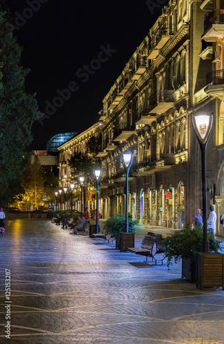 Nizami Street with bright night illumination. Shopping center of Baku.