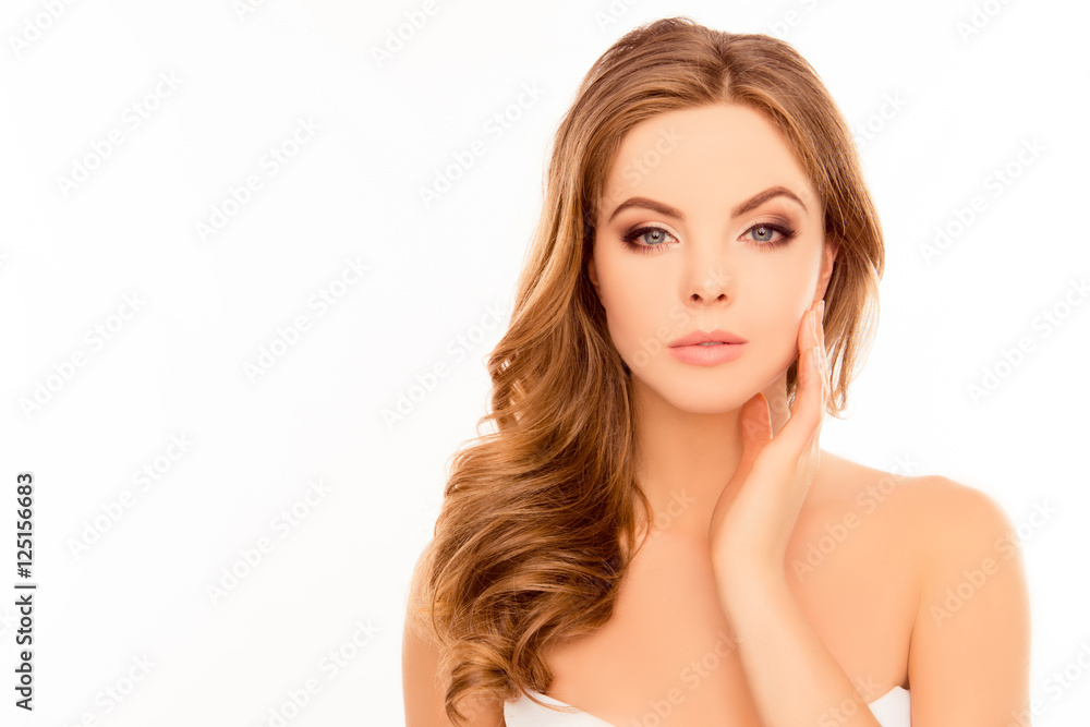 Young beautiful woman touching her face after shower Young beautiful woman touching her face after shower