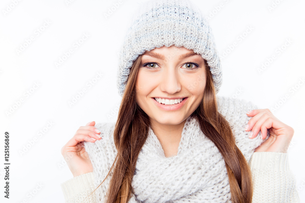 Cheerful woman clothing in warm hat and scarf, close up photo Cheerful woman clothing in warm hat and scarf, close up photo
