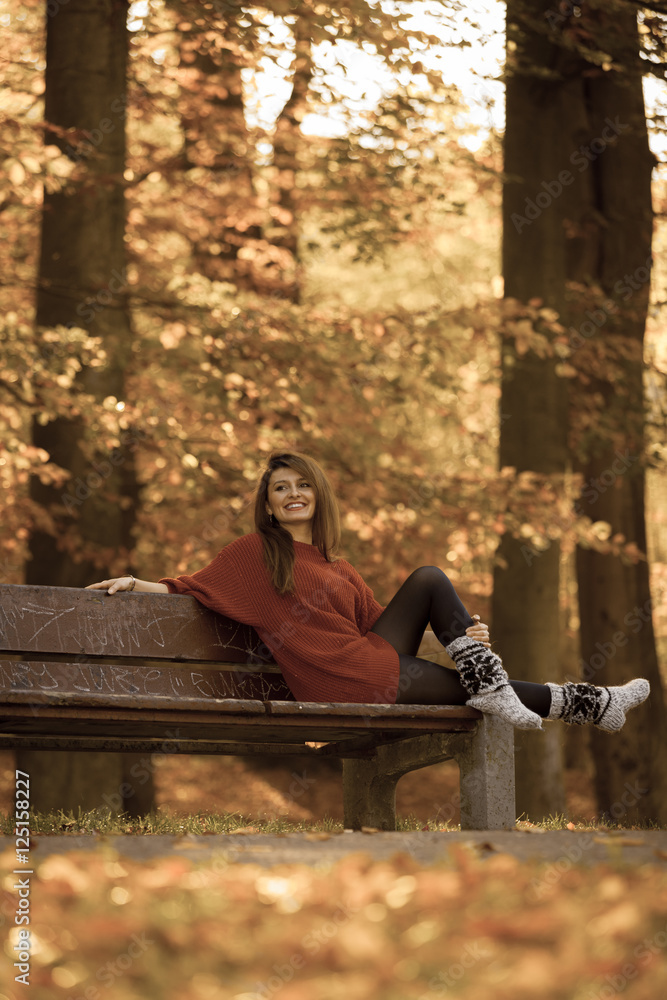 Woman relaxing on bench.