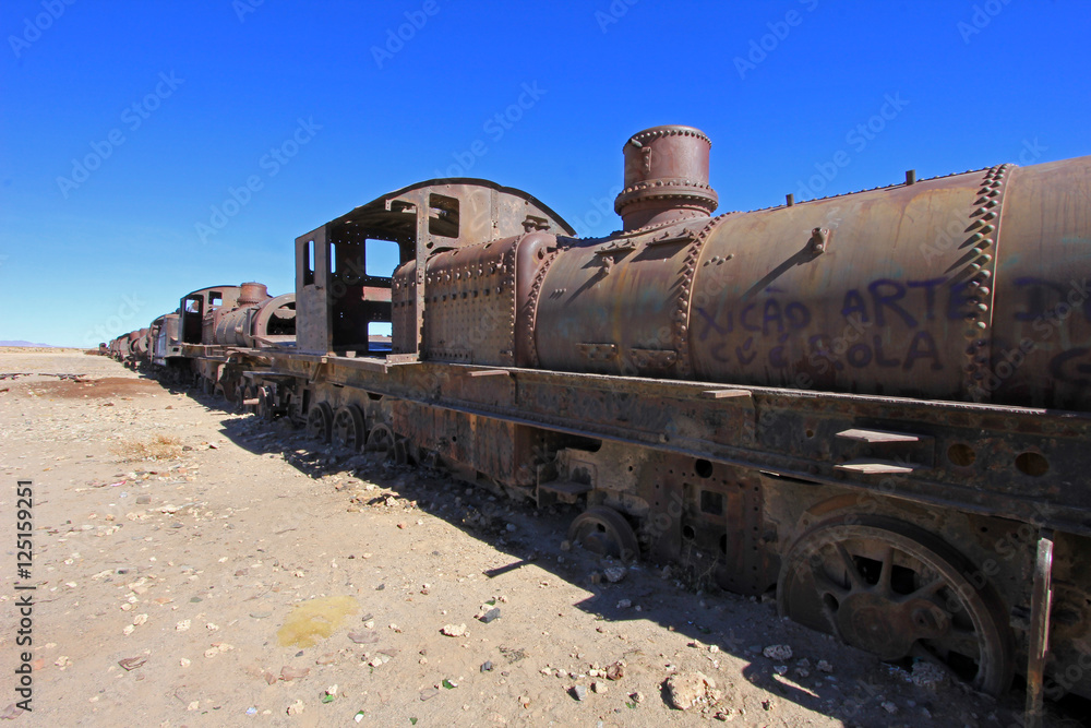 Naklejka premium Graveyard of rusty old trains in the desert of Uyuni, Bolivia
