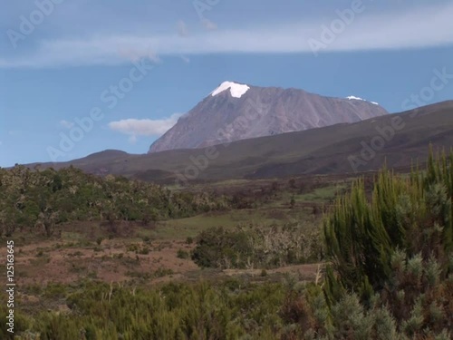 Time Lapse.Mt. Kilimanjaro, with 5.895 m Uhuru Peak Africas highest mountain as well as worlds highest free-standing mountain. One of World`s Largest Volcanoes. Video shot with an old camera. photo