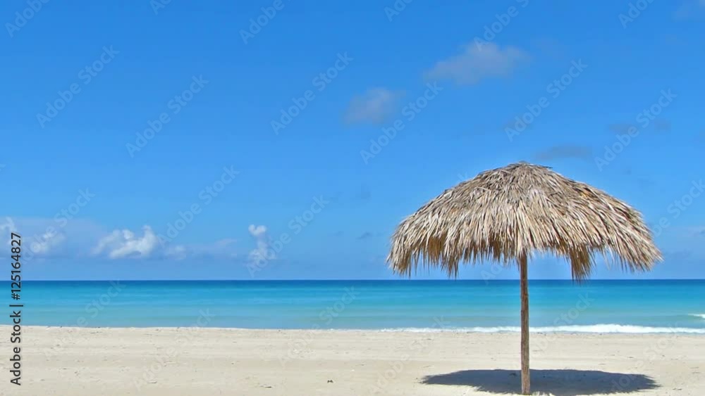 Parasol on the white sand beach.Copy space Parasol on the white sand beach.Copy space