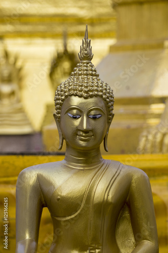 Fotografie Image of golden buddha statue in temple in province tak. Thailand