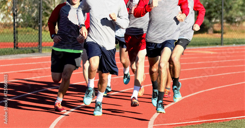 Boys group running on a track