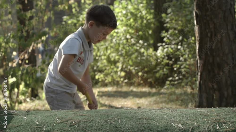 SLOW MOTION: Little golfer beats a golf ball SLOW MOTION: Little golfer beats a golf ball