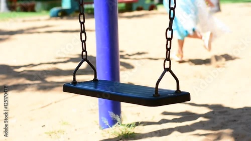Steel Swings playground in public park.