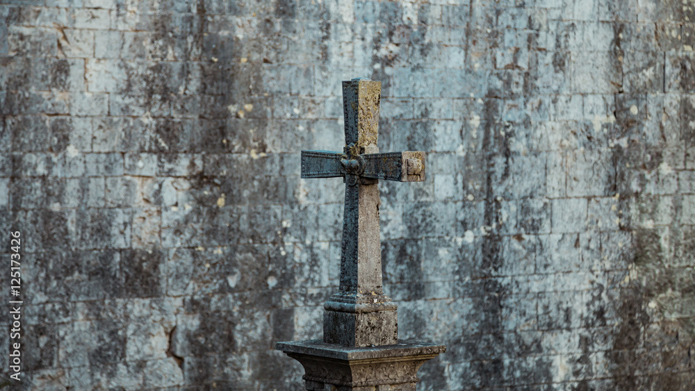 Tombstone in the form of a Catholic cross