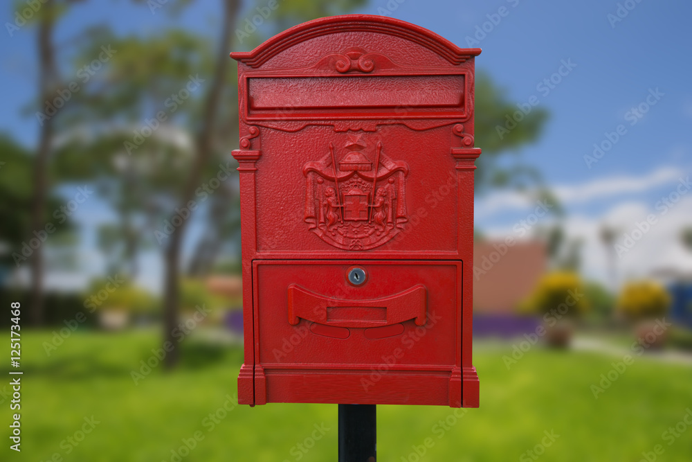 Big red mailbox isolate on park background. Big red mailbox isolate on park background.