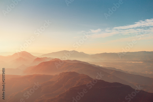 View of morning Montserrat mountains with haze and blue sky © skyNext