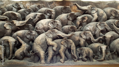 Wooden sculpture of elephant family © biggereye