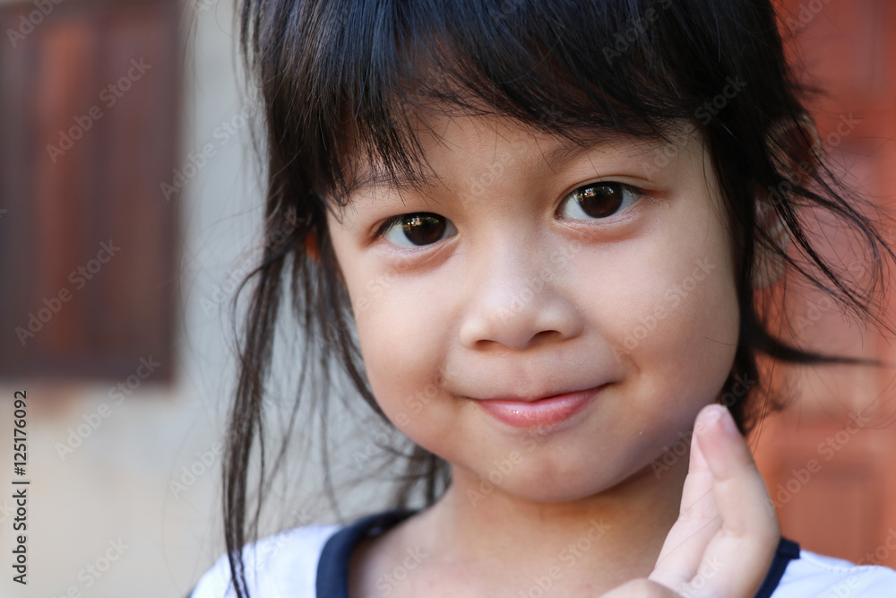 Cute girl asian face looking at the camera, she's happiness emotion Cute girl asian face looking at the camera, she's happiness emotion