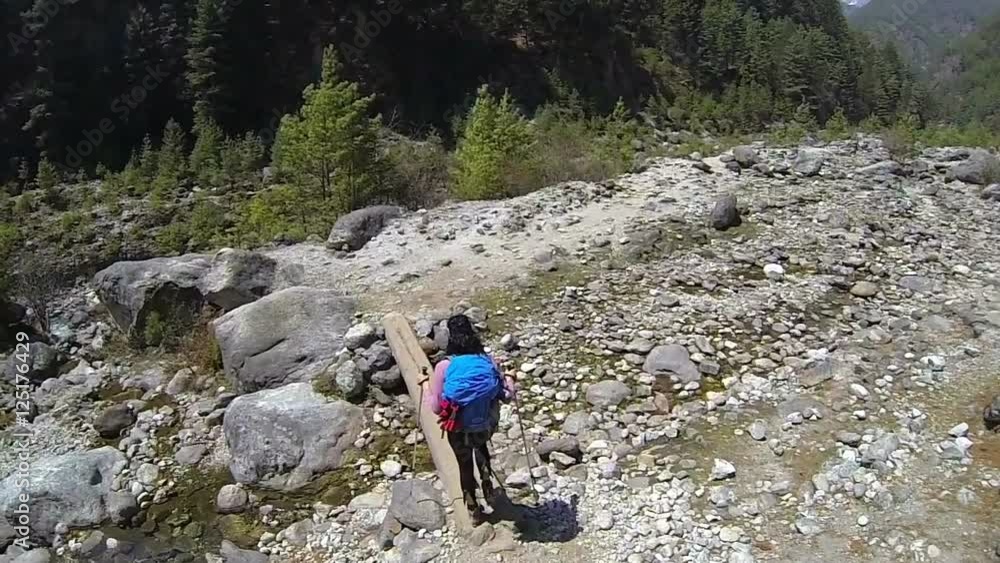 Rear view of female mountaineer. High speed camera,slow motion Rear view of female mountaineer. High speed camera,slow motion